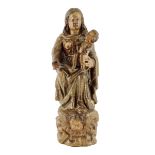 A late 17th century Spanish carved wood and polychrome decorated group of the Madonna Lactans,