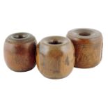 Treen. Three 19th century chogs, hardwood and lignum vitae, 9cm diameter (max). (3)