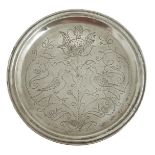 A late 17th century wrigglework pewter plate, with a triple reeded edge the centre decorated with