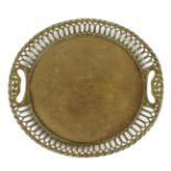 An 18th century brass tray, with a pierced gallery with a pair of handgrips, with scrolling leaf and