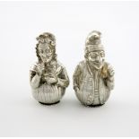 A pair of Victorian novelty silver pepper pots, Punch and Judy, by Joseph Clarke, London 1894,