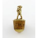 A Victorian silver-gilt bottle stopper, by George Fox, London 1864, modelled as a standing putto