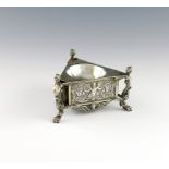 A 19th century German silver salt cellar, of triangular form, chased with figures and foliate