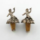 A pair of Victorian silver bottle stoppers, by John Samuel Hunt, London 1848, each modelled as a