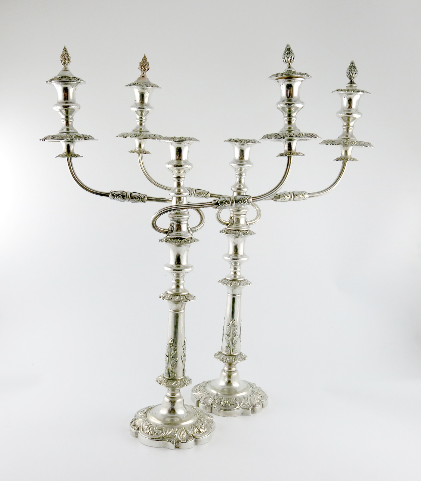 A pair of 19th century transitional Old Sheffield plated and electroplated three-light candelabra,