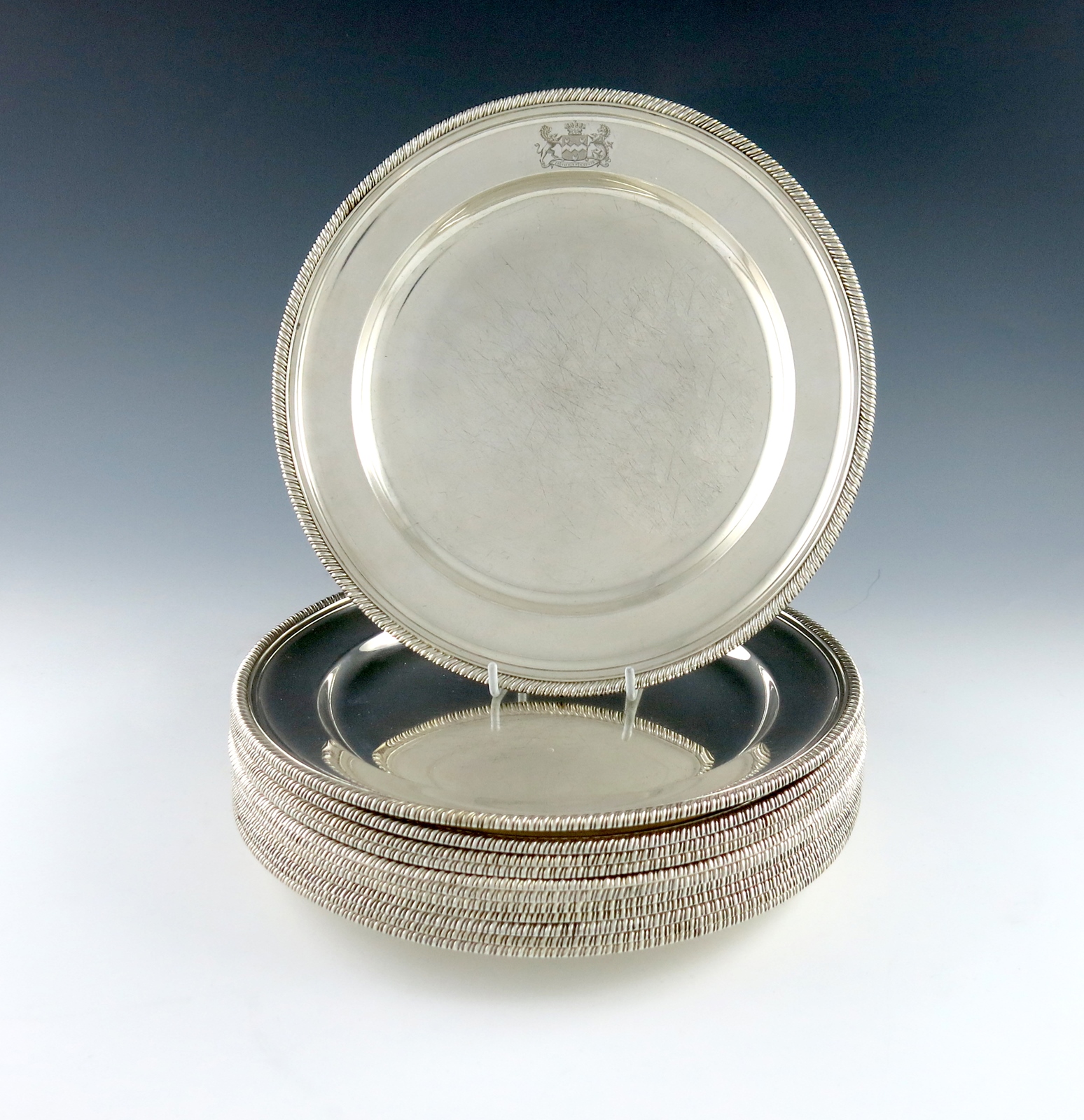A set of twelve Victorian electroplated plates, by Elkington and Co, 1876, circular form, gadroon