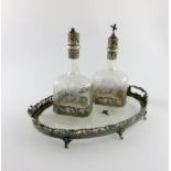 A late-Victorian pair of liqueur decanters and tray, with import marks for London 1881, importer's