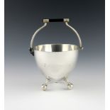 After a design by Christopher Dresser, a Victorian electroplated swing-handled sugar bowl, by