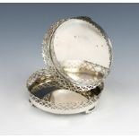 A pair of Portuguese silver wine coasters, Oporto, post 1938, circular form, pierced boarder, on