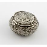 A continental silver snuff box, marks unidentified, probably 19th century, circular form, chased