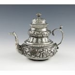 A 19th century Dutch silver teapot, 1875, tapering circular bellied form, embossed with figures