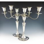 A pair of 19th-century Danish silver candlesticks with associated Edwardian silver three-light