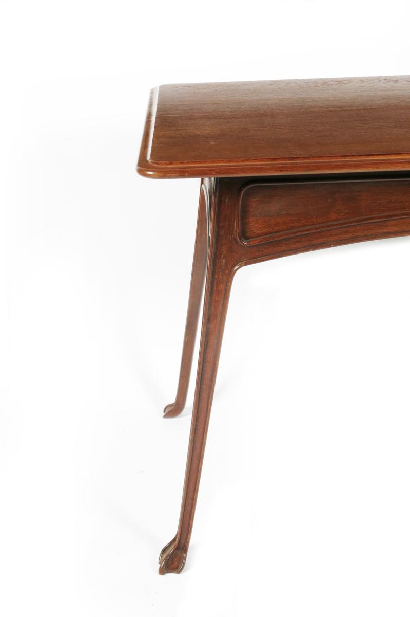 An Art Nouveau carved mahogany table designed by Edouard Colonna, rectangular top on slender - Image 2 of 2