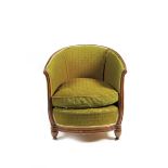 A mahogany tub chair in the manner of Andre Groult, with green upholstery 75cm. high