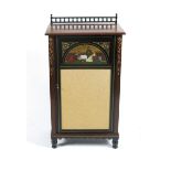 An Aesthetic Movement mahogany music cabinet, the door with painted panel of musicians, carved and