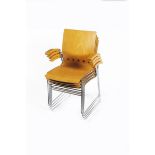 A set of four Herman Miller bentwood and chromed metal stacking armchairs, model no.RS101NA, each