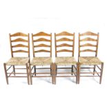A set of four Clissett ash chairs, ladderback, with rush seats, 98cm. high, (4)