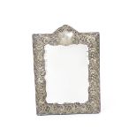 An Art Nouveau Synyer & Beddoes silver mirror frame, cast in low relief with scrolling and entwined