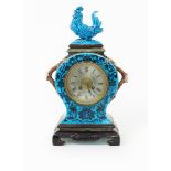 A French pottery mantel clock, in the manner of Theodore Deck, model number 668, the circular body