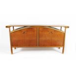 An Andrew Varah sycamore and ash veneered sideboard, slender form, two sets of arched twin doors