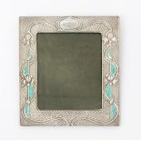 An American silver and enamel easel back picture frame, rectangular, stamped in low relief with Art