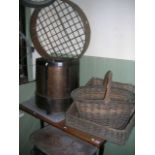 A vintage wooden and steel banded bushel, two wicker baskets of varying design, an old garden