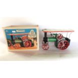A boxed Mamod steam tractor engine