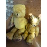 Two vintage teddy bears with inset glass eyes and padded paws