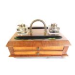 A good quality desk standish, principally in walnut, the top with two pen trays and inset looping