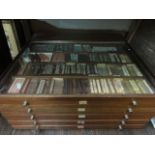 A Rowney Art Retailers display cabinet with glazed top and fitted with five drawers containing an