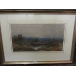 A late 19th century watercolour of a country landscape with cattle watering, distant hills, etc,