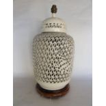 A Blanc de Chine type ceramic desk lamp in the form of a Chinese jar and cover with heavily