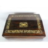 A small Victorian rosewood veneered writing slope,  the hinged and locking exterior decorated with