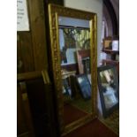 A good quality contemporary full length dressing mirror with rectangular plate within a mouled