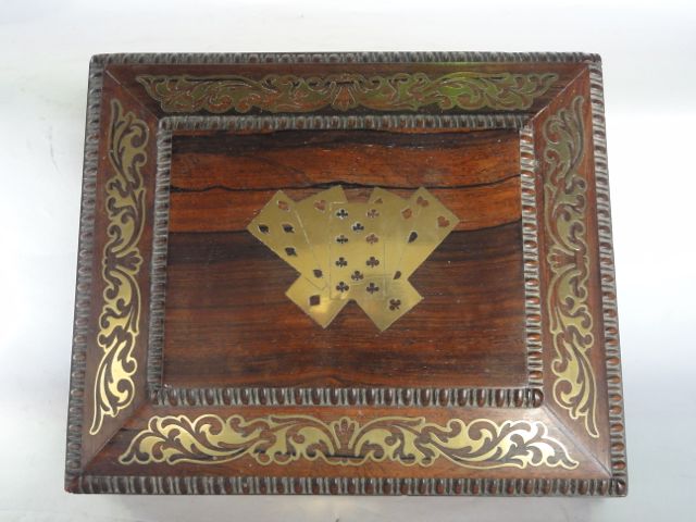 A good quality 19th century rosewood veneer games box of rectangular sarcophagus form with cut