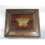 A good quality 19th century rosewood veneer games box of rectangular sarcophagus form with cut