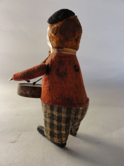 A small late 19th/early 20th century clockwork model of a drum playing clown portrayed with - Image 2 of 2