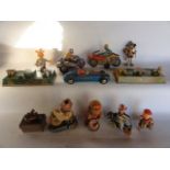 A selection of vintage toys to include a pair of clockwork printed tin models of lapping trains