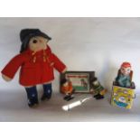An assortment of vintage toys to include a Paddington Bear in red felt coat, a boxed golfing game