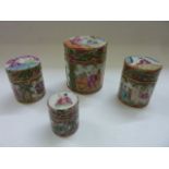 Four 19th century graduated Cantonese boxes and covers of cylindrical form with polychrome painted