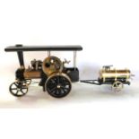 A boxed Wilesco model steam roller traction engine with working components, made in West Germany,