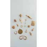 A miscellaneous collection of seven 9ct gold charms, 7g in total; a pair of 9ct gold hoop