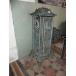 A 19th century French enamelled room heater with cast and pierced detail with original solid fuel