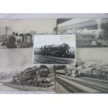 A collection of six black and white photographs of various steam trains mounted on board, together