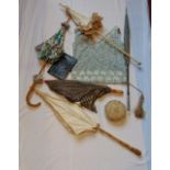 A selection of ladies vintage parasols together with a large pin cushion, a pale blue vest with