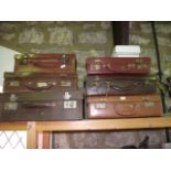 Six various stitched leather and simulated leather vintage briefcases, all with dual lever locks and