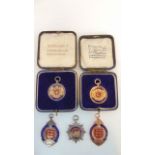 A 9ct gold and enamelled medallion, "Jersey Football association 1928 - 9", 15g; a cased 9ct gold