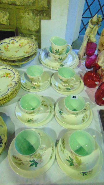 A six place Queen Anne Louise pattern tea service comprising milk jug, sugar bowl, cake plate,