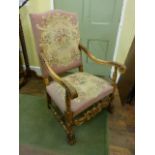 A late 19th century continental elbow chair with hand worked tapestry seat and back, framework