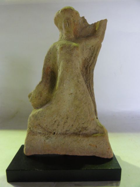 An early worked terracotta study of a standing figure, possibly Roman (face seemingly reworked),